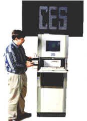 Bill Otto with CES portable keyboard/display terminal for Model 7 tufting control